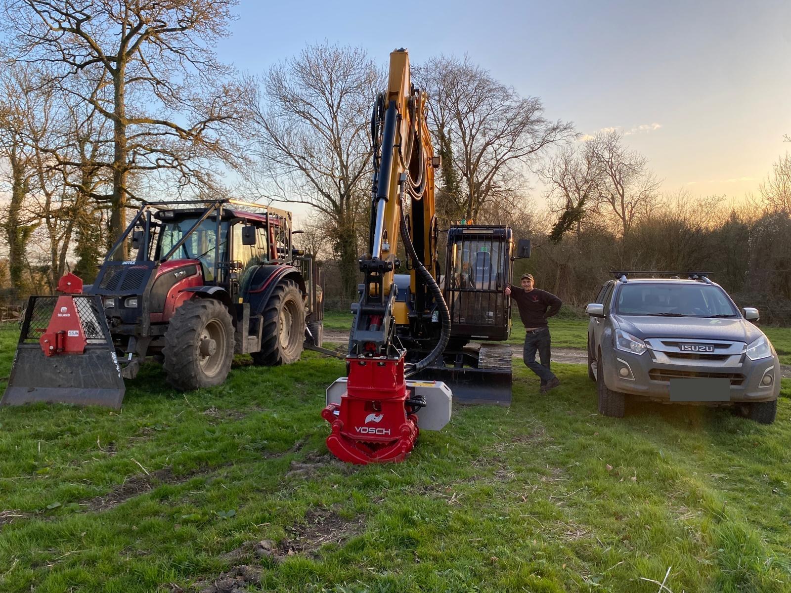Red Hart Forestry machinery, team member and Isuzu vehicle together at a site, with the vehicle plate obscured